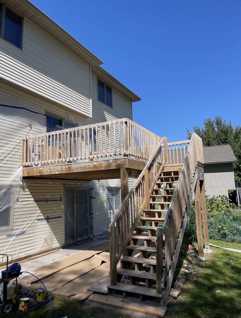 Weathered backyard deck before staining